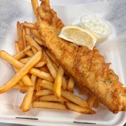 Hand-battered haddock fish and chips with lemon, tartar and crisp fries